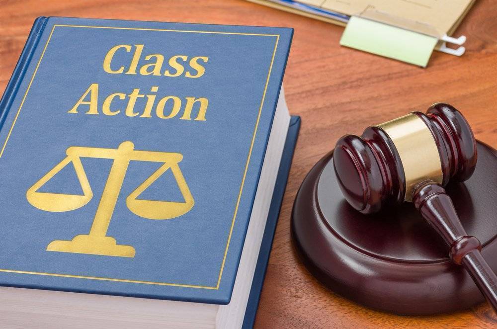 Class Action law book near a judge's gavel